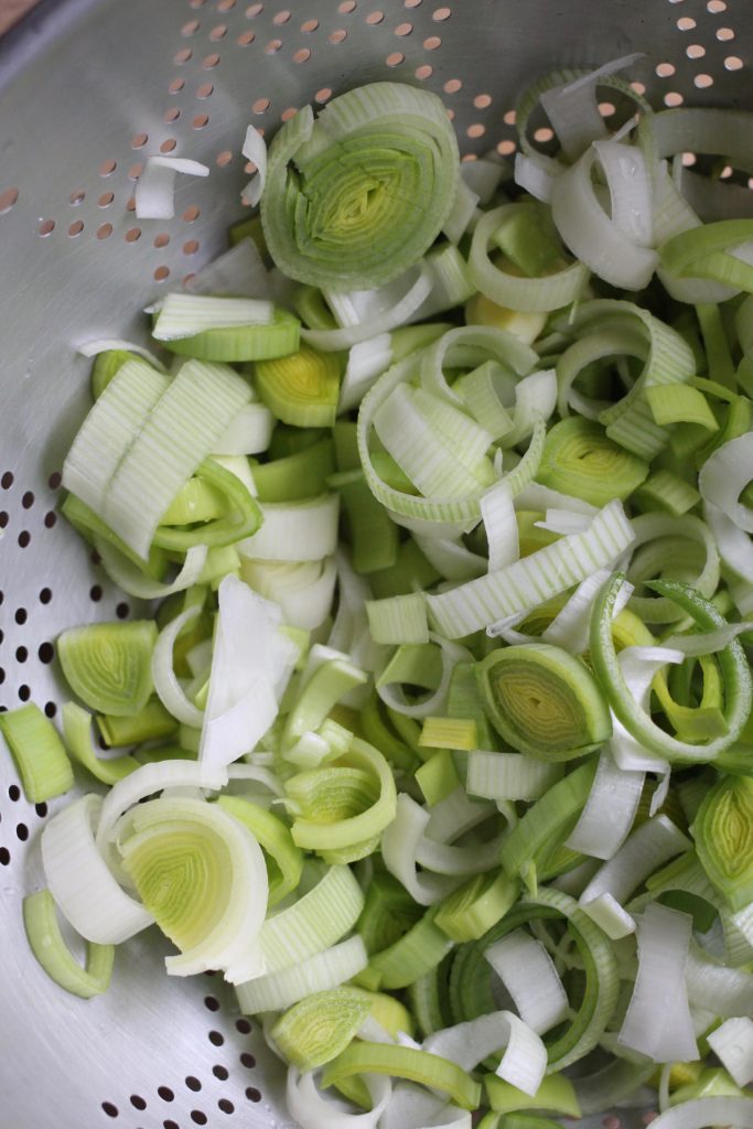 Fresh leeks are stirred into melted butter and softened
