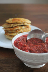 This rhubarb compote is flavoured with ginger and cinnamon, and coloured with raspberries. It's delicious over ice cream, yogurt, cake, pancakes, and oatmeal and freezes perfectly.
